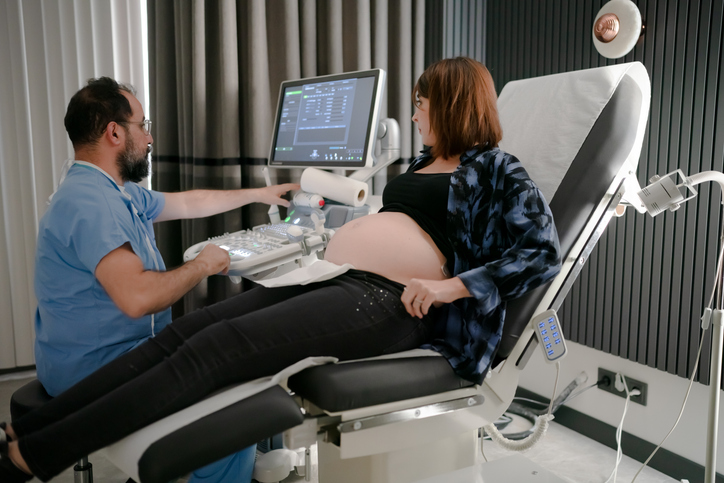 Photo shows a pregnant woman receiving an ultrasound in a gynecology clinic/Getty Images