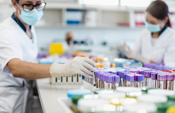 Photo shows scientists working in a laboratory/Getty Images